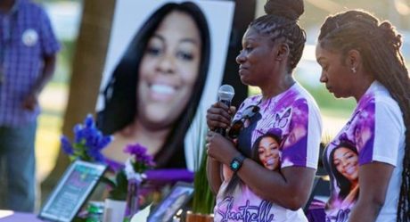 Woman in the United States told 911 she felt threatened before shooting her neighbor through the door