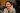 The Prime Minister of Thailand smiling and waving in court