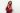 Whitney Houston wearing a stunning red dress, sparkling jewelry, and an elegant hairstyle