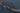 A ship in flames in the middle of the sea